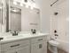 Bathroom with double sink vanity and updated fixtures at 26693 N 82Nd Dr, Peoria, AZ 85383