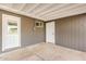 Covered patio with painted concrete and access doors at 2944 W Royal Palm Rd, Phoenix, AZ 85051