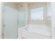 Bathroom featuring tub, shower and window at 2989 N 44Th St # 2007, Phoenix, AZ 85018