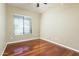 Bedroom features ceiling fan, hardwood floors and natural light from a large window at 2989 N 44Th St # 2007, Phoenix, AZ 85018