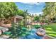 Community area showcasing a lush pond, landscaped grounds, cabana and pool at 2989 N 44Th St # 2007, Phoenix, AZ 85018