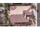 Aerial view of a neighborhood with tile roofs, landscaping, and community golf course at 3401 E Isaiah Ave, Gilbert, AZ 85298