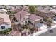 Aerial view of a home with tile roof, desert landscaping, and front-facing garage at 3401 E Isaiah Ave, Gilbert, AZ 85298