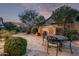 Charming backyard with a decorative tiled fountain and cozy outdoor seating area at 3401 E Isaiah Ave, Gilbert, AZ 85298