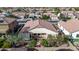 Aerial view of the backyard with a covered patio, outdoor seating, and desert landscaping, creating a private retreat at 3401 E Isaiah Ave, Gilbert, AZ 85298