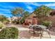 Spacious backyard featuring a decorative fountain and shaded seating area at 3401 E Isaiah Ave, Gilbert, AZ 85298