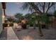 Inviting backyard with a water feature, stone pathway, and desert landscaping at 3401 E Isaiah Ave, Gilbert, AZ 85298