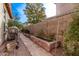 Backyard with brick planter bed, brick ground cover, and outdoor grill at 3401 E Isaiah Ave, Gilbert, AZ 85298