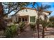 Beautifully landscaped backyard with a covered patio, mature trees, and desert plants at 3401 E Isaiah Ave, Gilbert, AZ 85298
