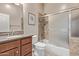 Bathroom features a sink with granite countertop, a toilet, and a shower at 3401 E Isaiah Ave, Gilbert, AZ 85298