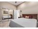 Bedroom with a bed, mirrored closet doors, and neutral colored walls at 3401 E Isaiah Ave, Gilbert, AZ 85298