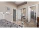 Bedroom featuring two entryways and a mirrored closet door at 3401 E Isaiah Ave, Gilbert, AZ 85298