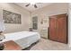 Bedroom featuring a bed, window, and wardrobe cabinet at 3401 E Isaiah Ave, Gilbert, AZ 85298