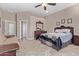 Spacious bedroom featuring a ceiling fan, and a dresser with a mirror at 3401 E Isaiah Ave, Gilbert, AZ 85298
