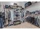 Organized walk-in closet with shelving, hanging racks and plenty of storage space at 3401 E Isaiah Ave, Gilbert, AZ 85298