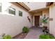 Inviting entrance with a decorative walkway and charming details leading to a solid wood front door at 3401 E Isaiah Ave, Gilbert, AZ 85298