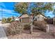 View of the exterior showcasing the attached two-car garage, desert landscaping, and neutral color palette at 3401 E Isaiah Ave, Gilbert, AZ 85298