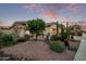 Charming front yard featuring desert landscaping with cacti and succulents at dusk at 3401 E Isaiah Ave, Gilbert, AZ 85298