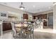 Charming kitchen/dining area with a view of stainless steel appliances and granite countertops at 3401 E Isaiah Ave, Gilbert, AZ 85298