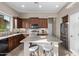 Well-equipped kitchen featuring stainless steel appliances, a center island, and ample cabinet space at 3401 E Isaiah Ave, Gilbert, AZ 85298