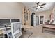 Bright home office features modern desk, bookcase, and built-in shelving at 3401 E Isaiah Ave, Gilbert, AZ 85298