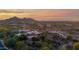 Breathtaking aerial view showcases the estate's desert surroundings and picturesque mountain backdrop at 34460 N 79Th Way, Scottsdale, AZ 85266