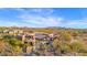 Aerial view showing the home's unique architectural style, outdoor living spaces, pool and landscaped grounds at 34460 N 79Th Way, Scottsdale, AZ 85266