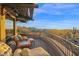 Covered balcony with lounge chairs offers desert views at 34460 N 79Th Way, Scottsdale, AZ 85266