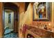 Elegant bathroom with a marble sink and stone tile shower at 34460 N 79Th Way, Scottsdale, AZ 85266