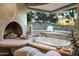 Luxurious bathroom featuring a soaking tub, fireplace, and serene views at 34460 N 79Th Way, Scottsdale, AZ 85266