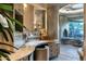 Bathroom vanity with unique architecture, interesting angles, and a view of the outdoors at 34460 N 79Th Way, Scottsdale, AZ 85266