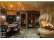Unique dining room with stone floors and fireplace at 34460 N 79Th Way, Scottsdale, AZ 85266