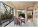 Dining area with wicker chairs and views of the lush patio at 34460 N 79Th Way, Scottsdale, AZ 85266