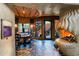 Unique dining room with stone floors and fireplace at 34460 N 79Th Way, Scottsdale, AZ 85266
