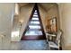 Welcoming entrance with a custom triangular door, natural stone flooring, and stylish decor creating a unique first impression at 34460 N 79Th Way, Scottsdale, AZ 85266