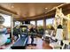 Home gym features workout machines and scenic views at 34460 N 79Th Way, Scottsdale, AZ 85266