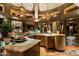 Gourmet kitchen featuring stone countertops, custom cabinetry, and modern lighting at 34460 N 79Th Way, Scottsdale, AZ 85266