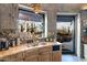 Well-appointed kitchen with granite countertops and views of the backyard pond at 34460 N 79Th Way, Scottsdale, AZ 85266