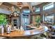 Gourmet kitchen featuring stone countertops, custom cabinetry, and modern lighting at 34460 N 79Th Way, Scottsdale, AZ 85266