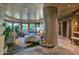 Spacious main bedroom with stone floors, curved windows and lots of natural light at 34460 N 79Th Way, Scottsdale, AZ 85266