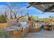 Outdoor kitchen with a built-in grill, seating, and beautiful desert views at 34460 N 79Th Way, Scottsdale, AZ 85266