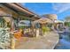 Covered patio featuring comfortable seating, desert landscape views, and seamless indoor-outdoor living at 34460 N 79Th Way, Scottsdale, AZ 85266