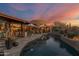 Twilight view of a desert home with an inviting pool and outdoor living area at 34460 N 79Th Way, Scottsdale, AZ 85266