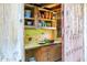 Rustic potting shed with wooden shelves, sink, and storage, perfect for gardening enthusiasts at 34460 N 79Th Way, Scottsdale, AZ 85266