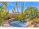 Inviting spa surrounded by lush desert landscaping, enhancing the outdoor living experience at 34460 N 79Th Way, Scottsdale, AZ 85266