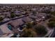 Aerial view of a home in a neighborhood featuring a trampoline, solar panels, and desert landscaping at 3456 E Joseph Way, Gilbert, AZ 85295