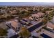 An aerial view of a home in a residential neighborhood showing solar panels and desert landscaping at 3456 E Joseph Way, Gilbert, AZ 85295