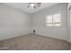 Cozy bedroom with chair rail, ceiling fan, and carpeted floor at 3456 E Joseph Way, Gilbert, AZ 85295