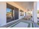 Inviting covered patio with outdoor seating, ceiling fans, and views of the backyard and pool at 3706 E Ravenswood Dr, Gilbert, AZ 85298