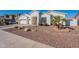 Elegant white stucco home with a three-car garage and desert landscaping at 3706 E Ravenswood Dr, Gilbert, AZ 85298